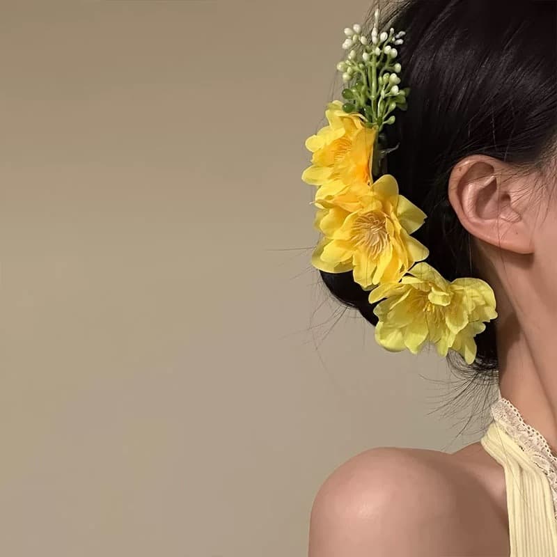 Bright yellow flower hair comb