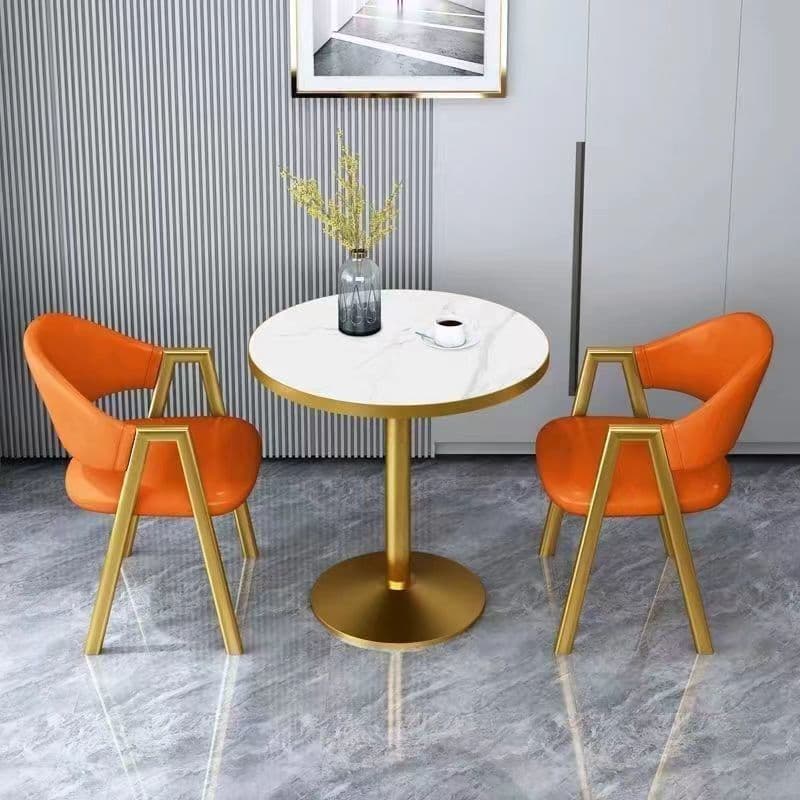 Imitation white marble table top + golden orange leather chair