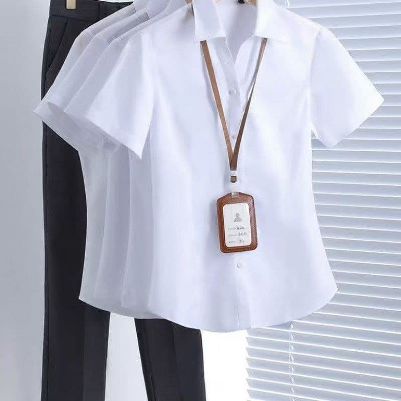 White v-neck short sleeves with exposed buttons