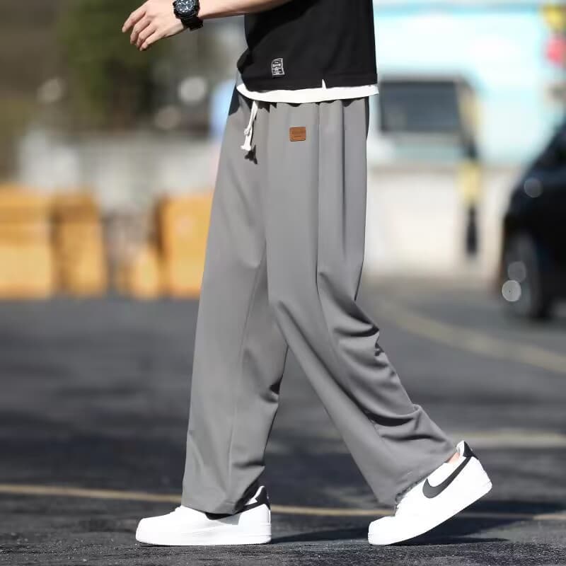 Leather label four-way stretch pants dark gray