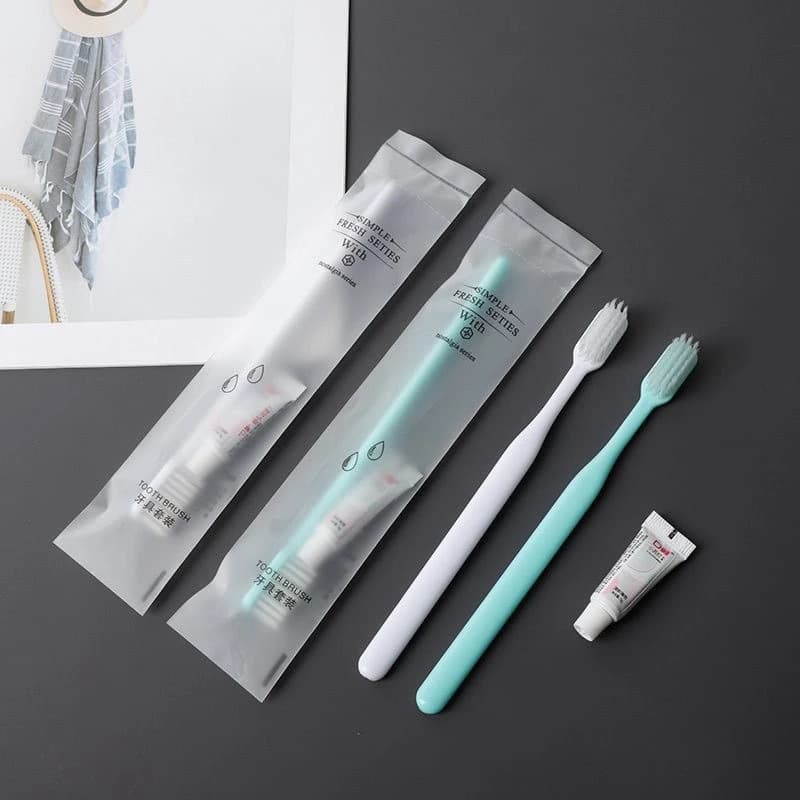 Soft film packaging + white and green small semi-circular toothbrush + [toothpaste with lid]
