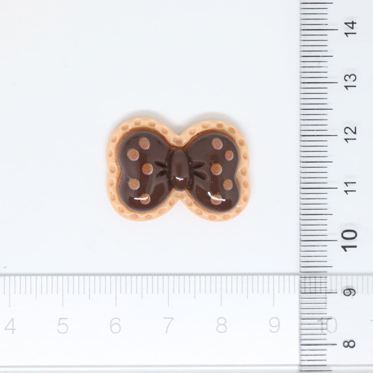 Brown dotted bow