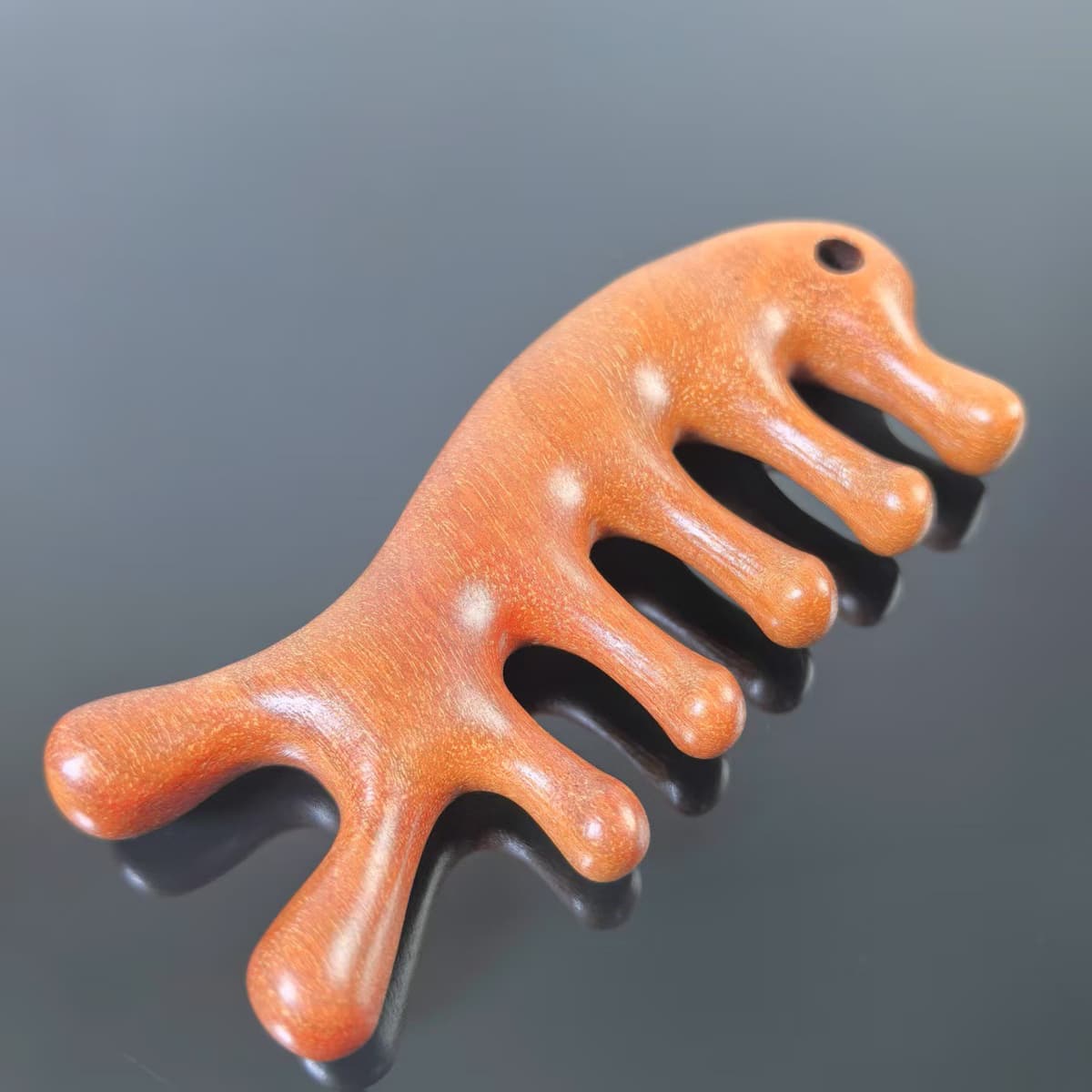 Dragon and phoenix sandalwood perforated dolphin massage comb