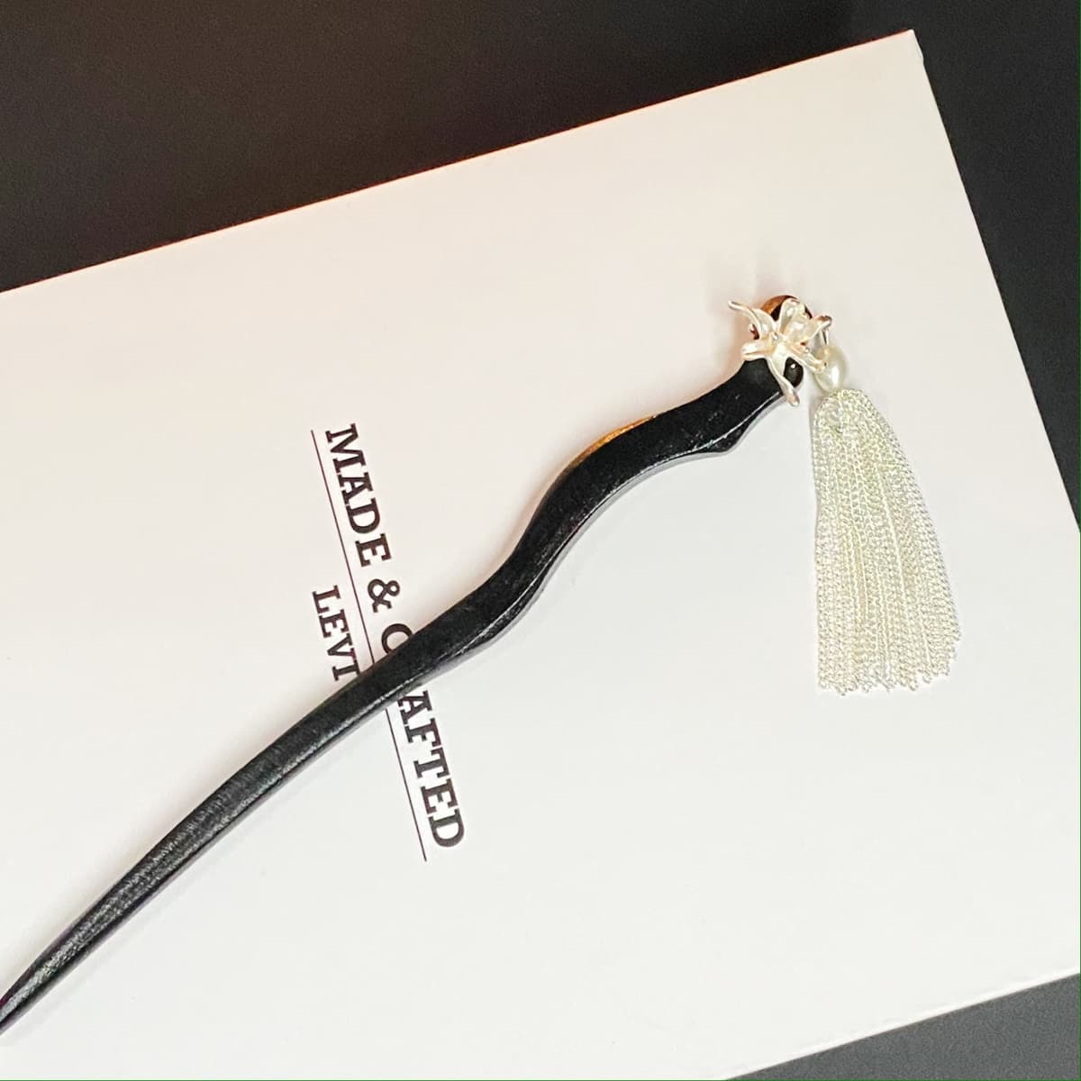 184# silver tassel