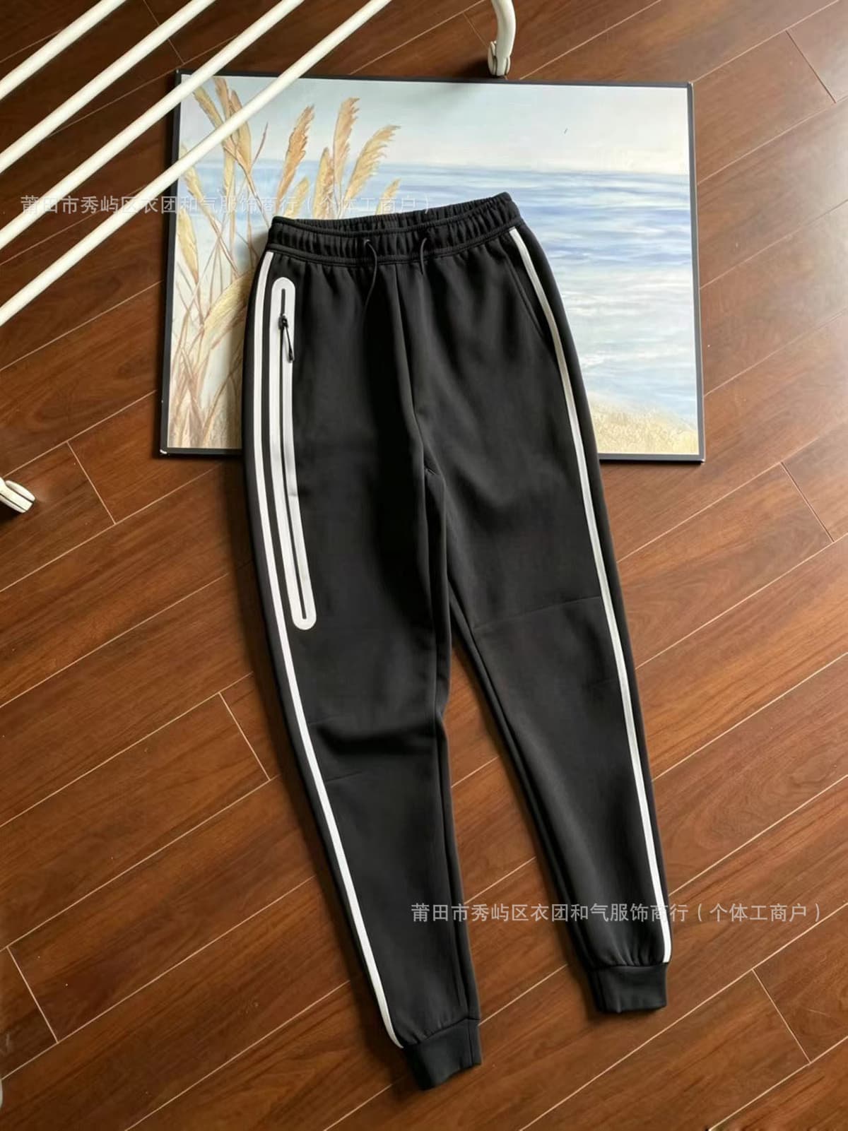Pants. black (orange swoosh)