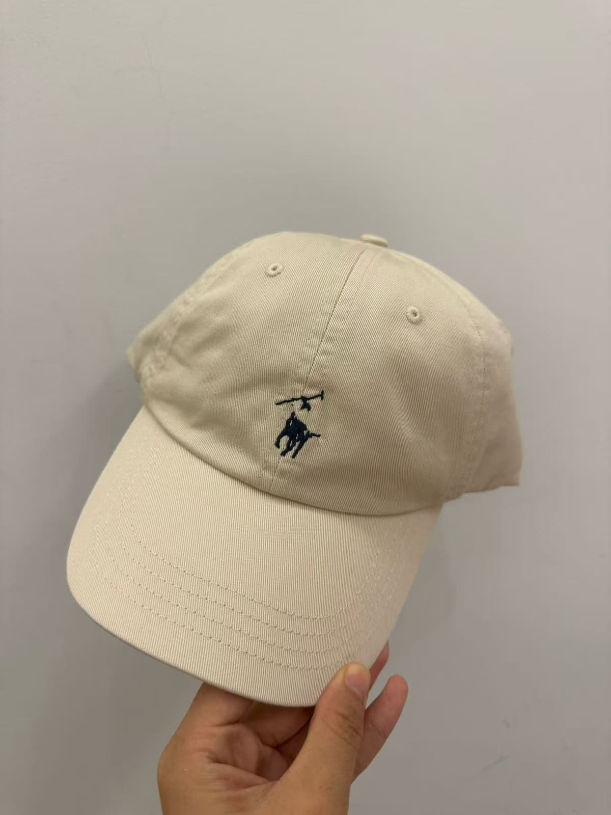 Beige navy blue label