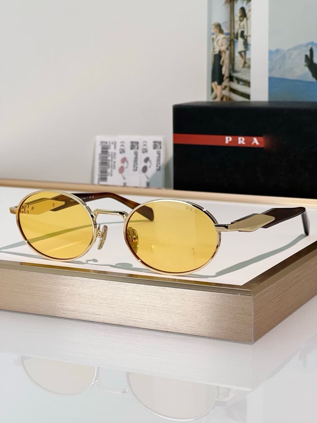 Gold frame, brown lens