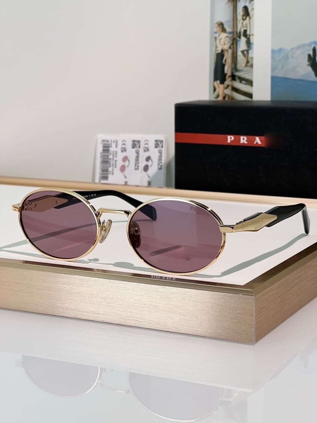 Gold frame, pink lens