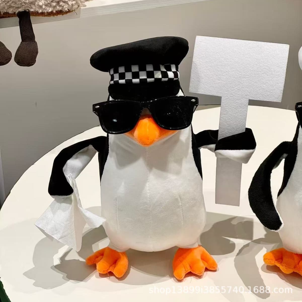 Penguin holding sign