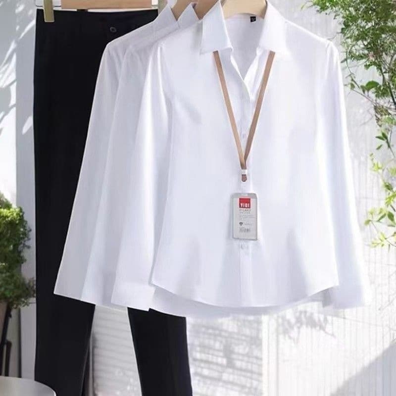 White v-neck long sleeves with exposed buttons