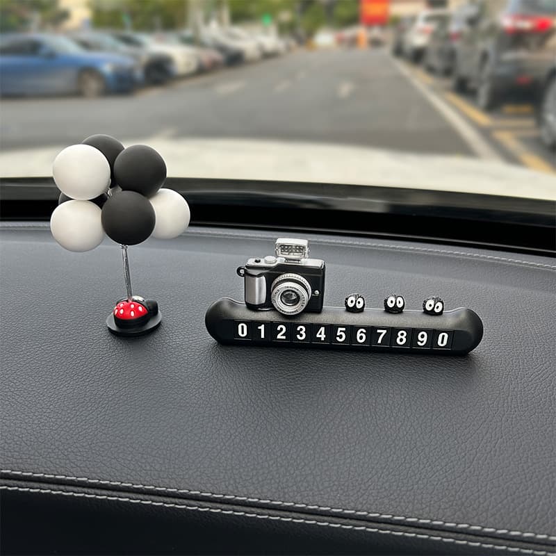 Four sets of mobile numbers [black] digital cameras + 3 small briquettes + gray and white balloons