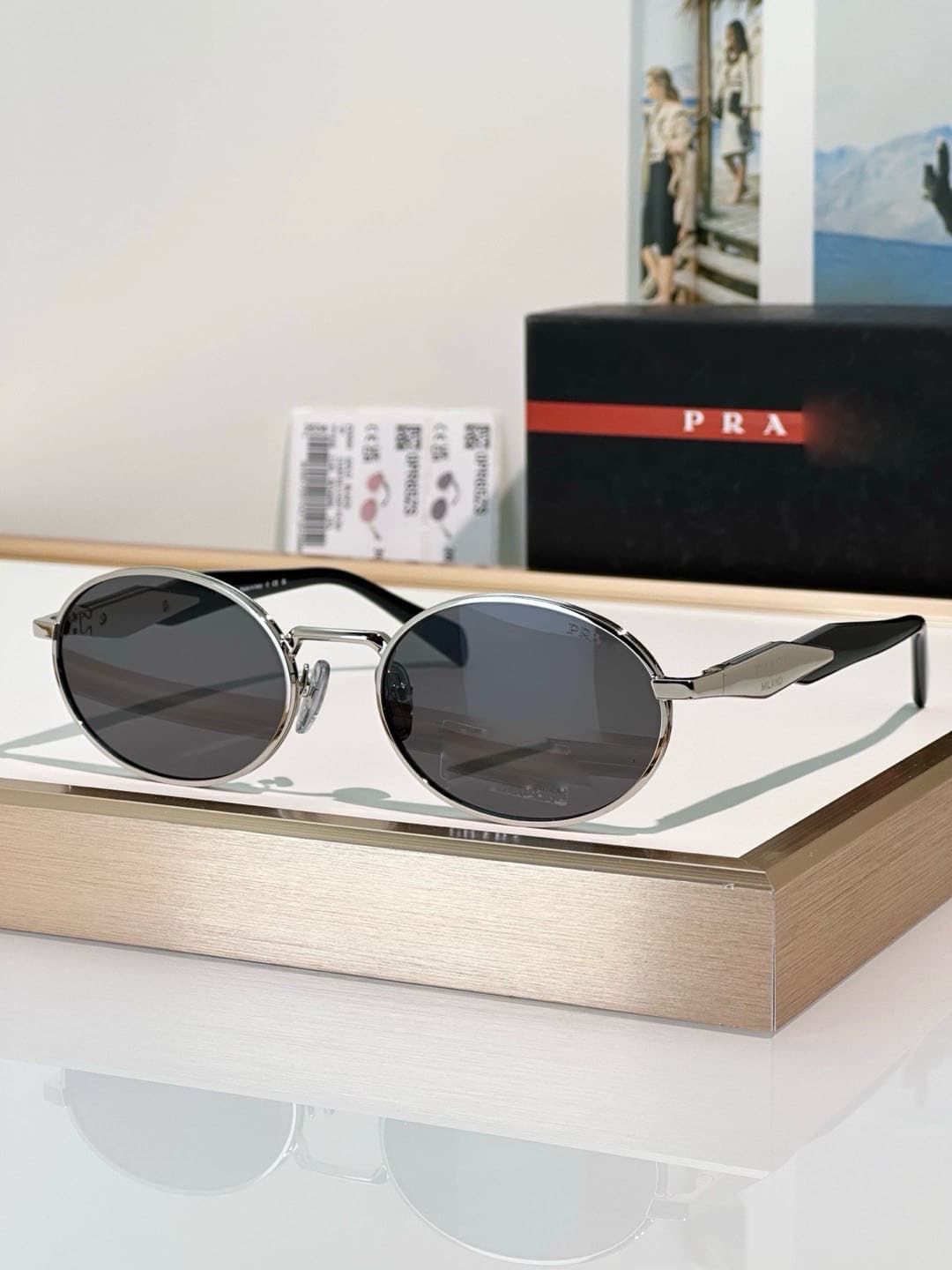 Silver frame, grey lens