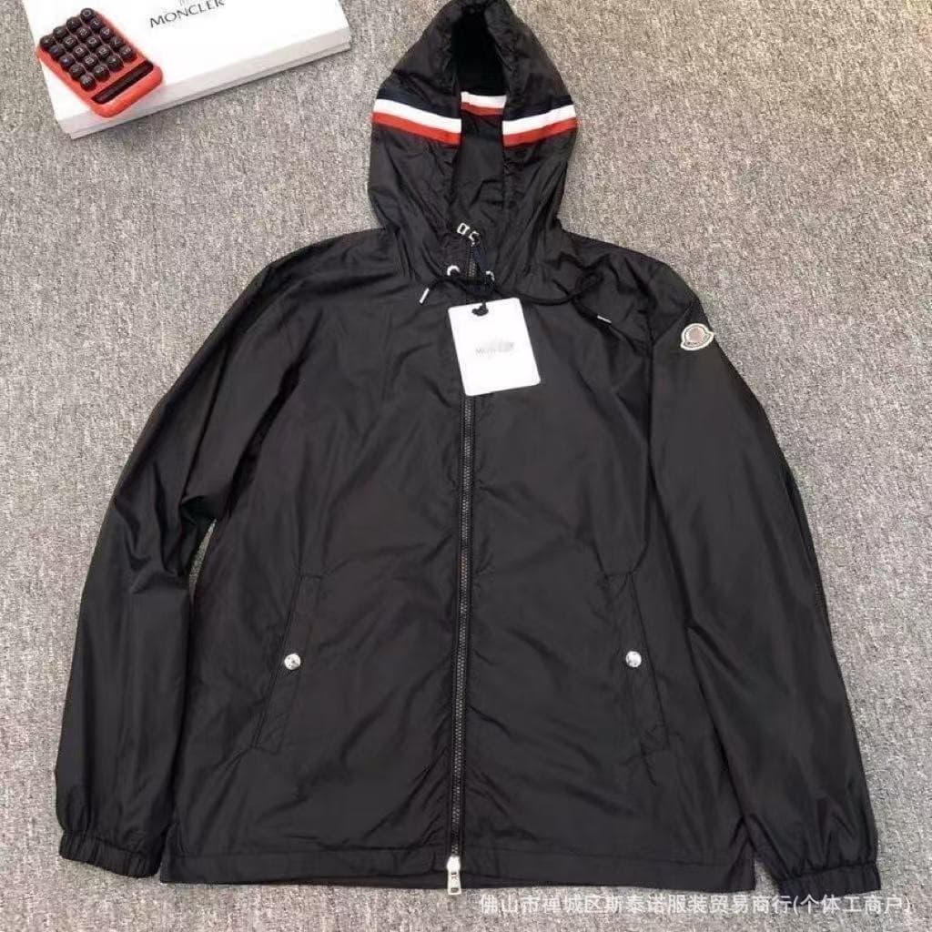Black windbreaker with colorful stripe detail