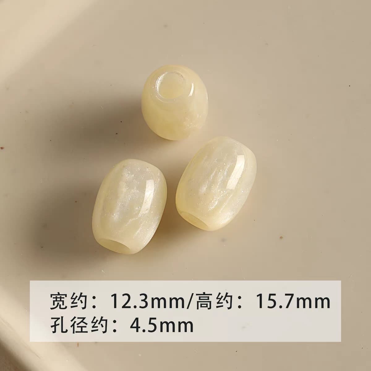 1 light yellow barrel bead