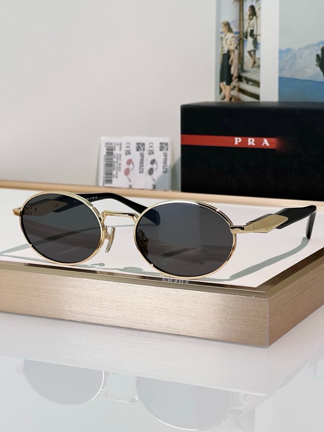 Gold frame, grey lens