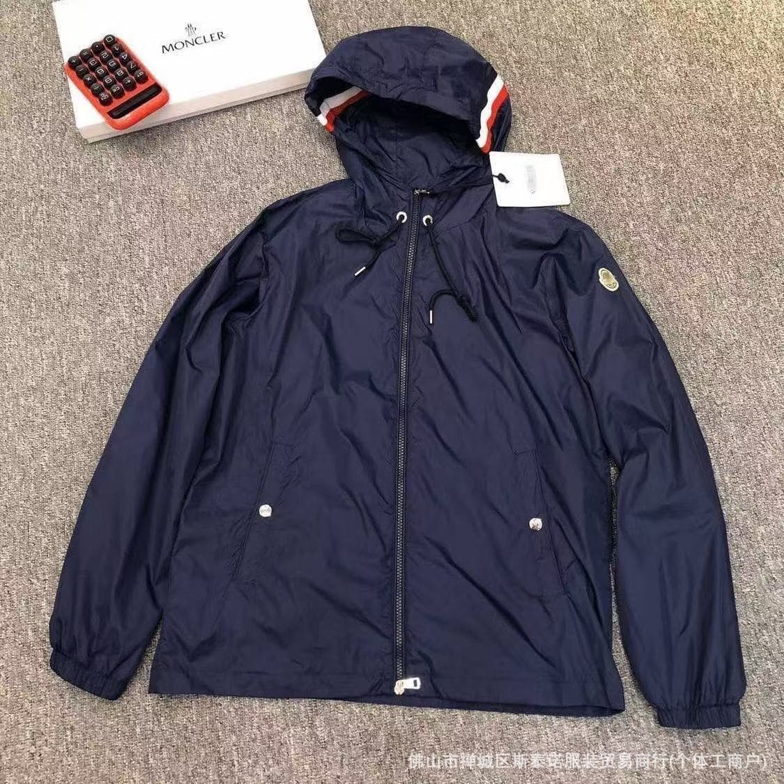 Navy blue windbreaker with hat color stripes