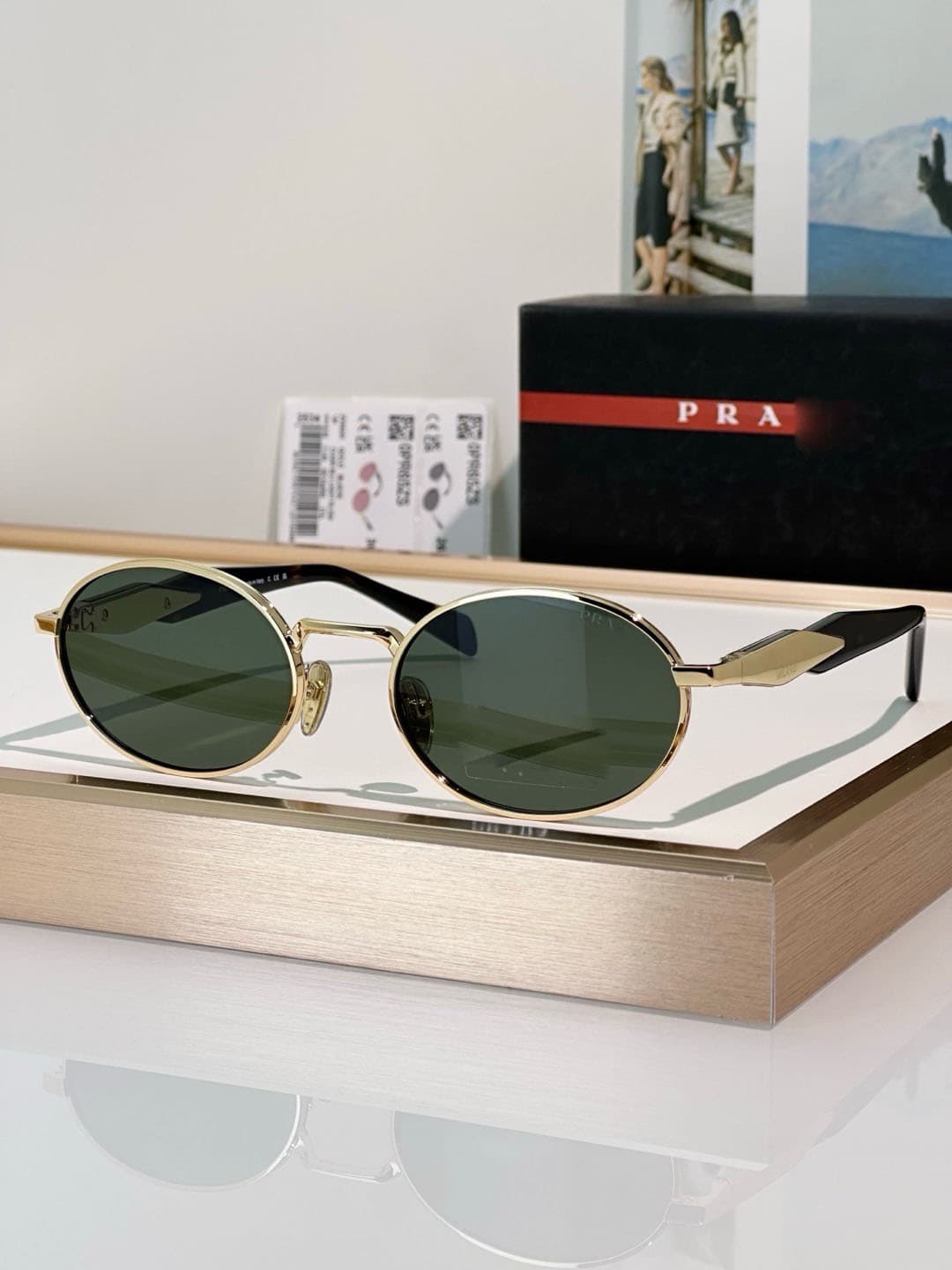 Gold frame, dark green lens