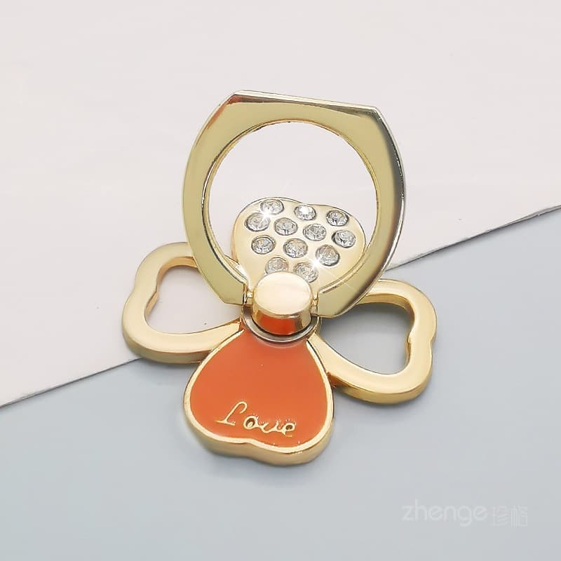 Gold - four-leaf clover sparkling diamond ring stand