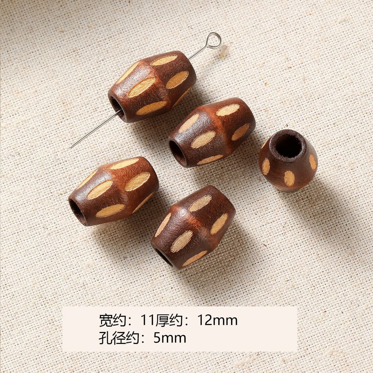 1 light brown spotted bead