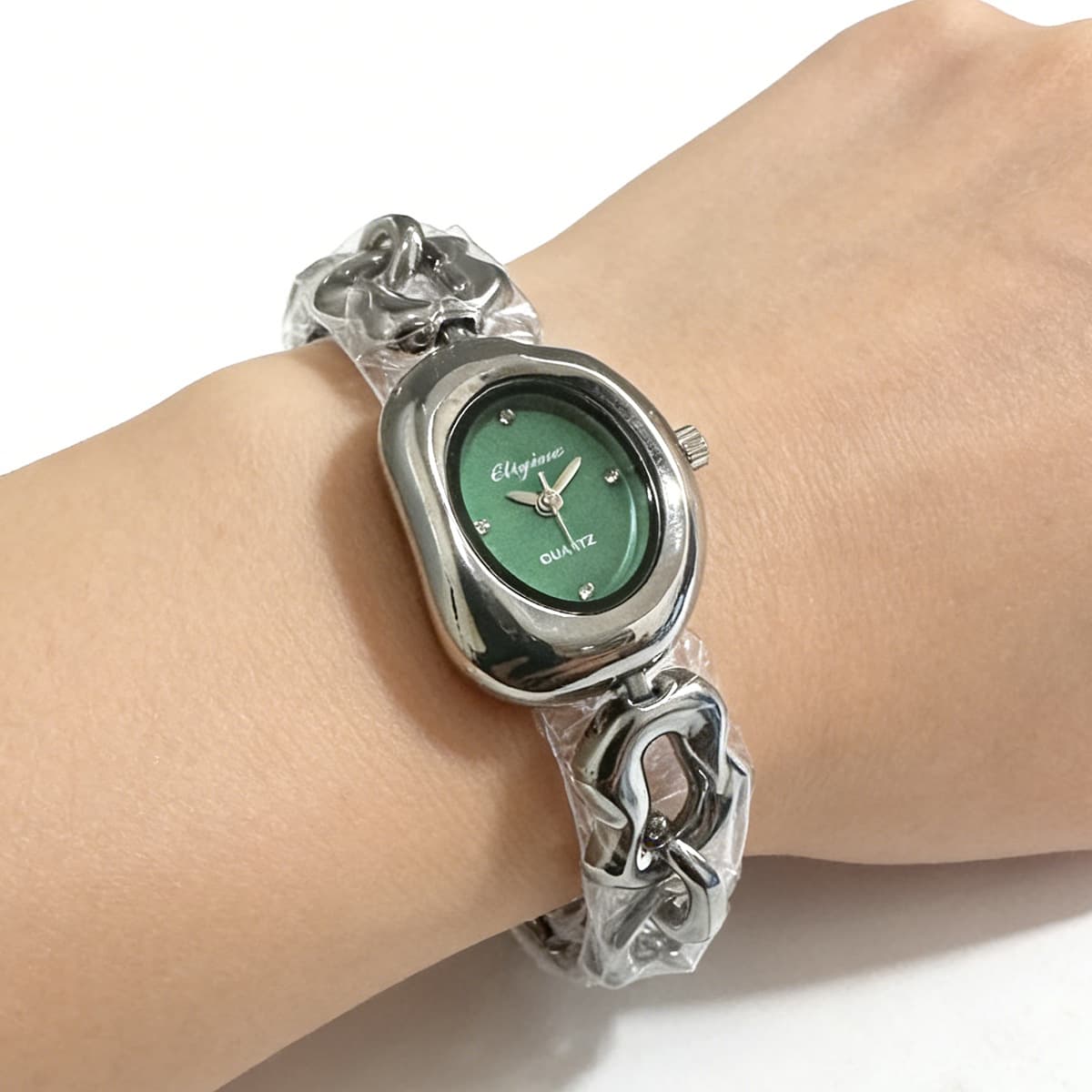 Silver shell green surface