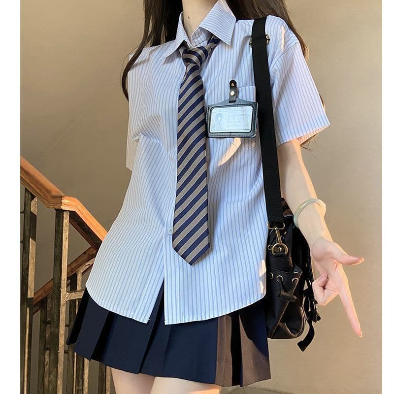 Blue striped shirt + navy blue skirt + blue stripe tie