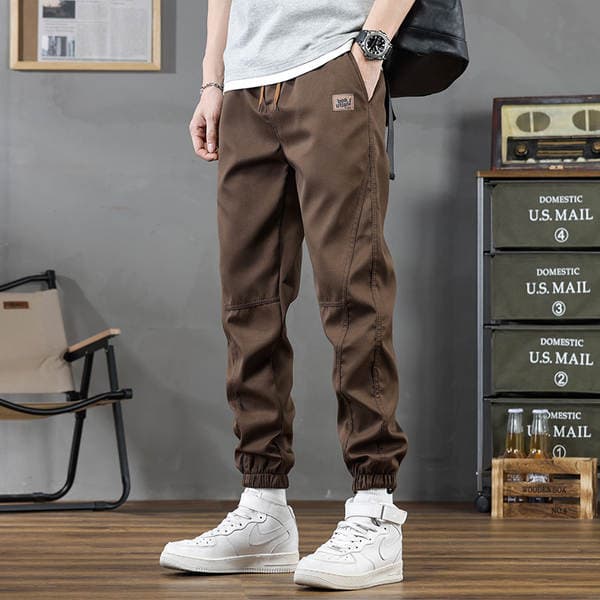 Kişilər üçün dəbli brend casual şalvar. 2025 Yaz-Payız yeni model, boş idman jogger/iş şalvarı.